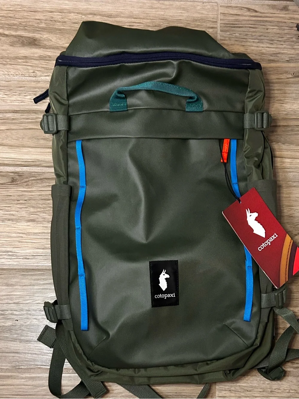 cotopaxi Olive Green Backpack with Blue and Teal Accents